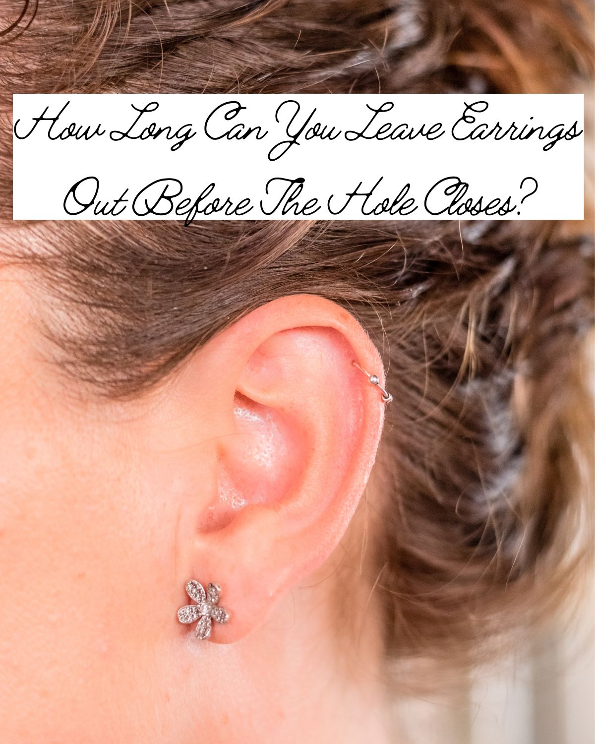 A woman wearing a flower earring
