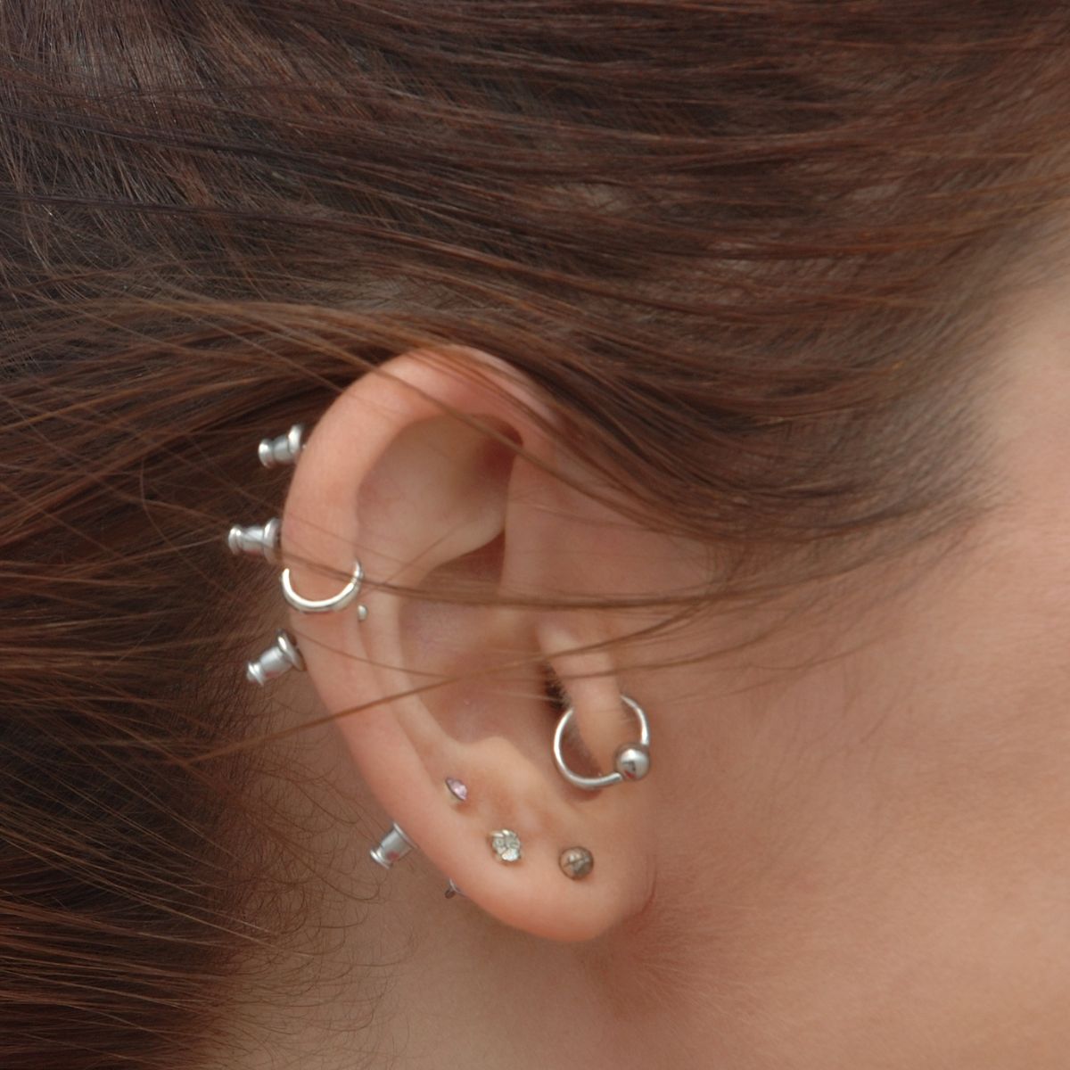 Several ear piercings on one ear