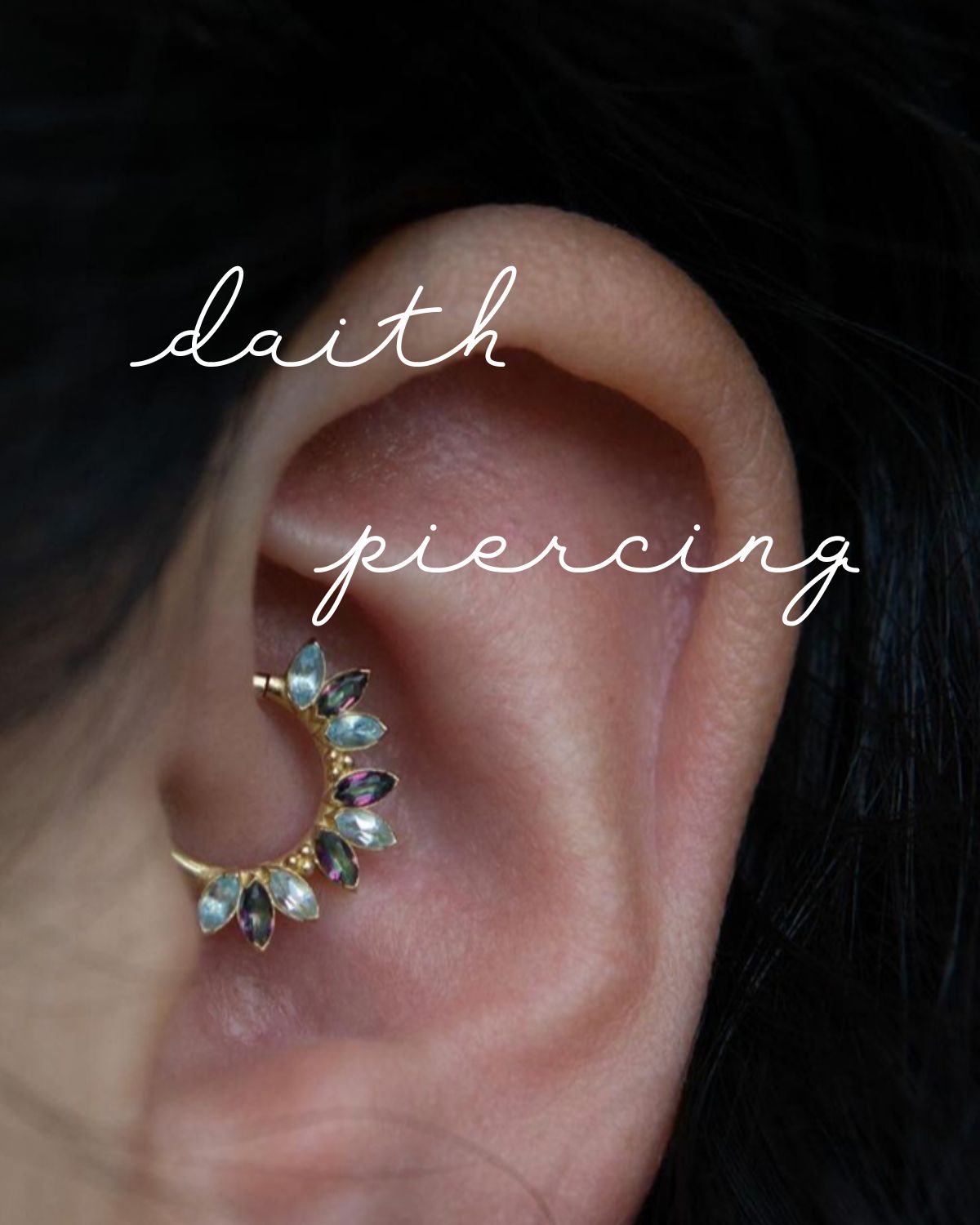 A daith piercing with many stones on a hoop